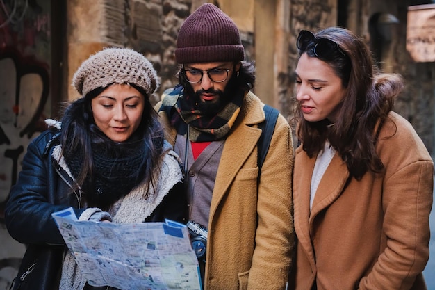 group multiracial tourist friends looking searching directions map guide ejoying trip visiting city vacations travel concept high quality photo 639864 457